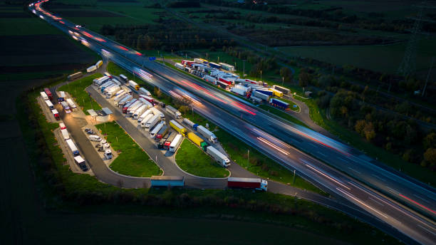 Highway and rest area at dusk - aerial view