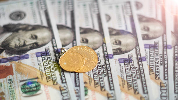 istock full and quarter gold standing dolar banknotes 1472301714