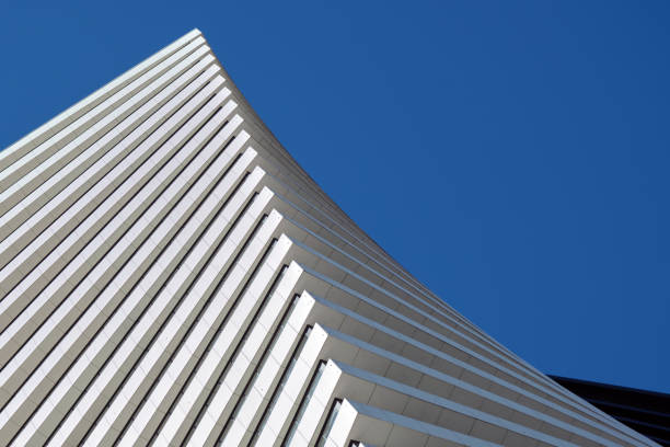istock Two beautiful modern office skyscrapers against the sky. 1472304846