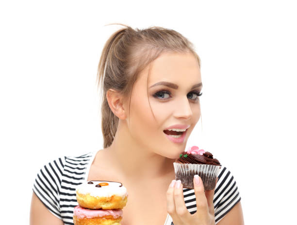 istock Funny girl  and colorful donuts. 1472305237