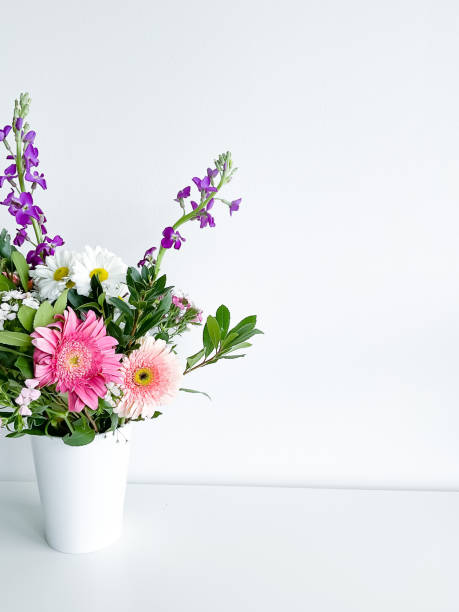 istock bouquet flowers in white vase. dianthus. daylight 1472305668