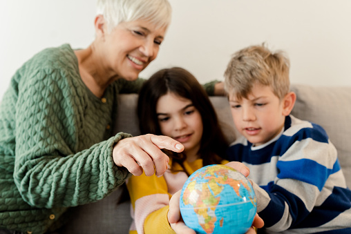 https://media.istockphoto.com/id/1472307901/photo/senior-woman-showing-the-globe-to-her-cute-grandchildren.jpg?b=1&s=170667a&w=0&k=20&c=PJGkpSFp507CBak939xBzhMM-VvmiaJRhauKgbJOhVg=