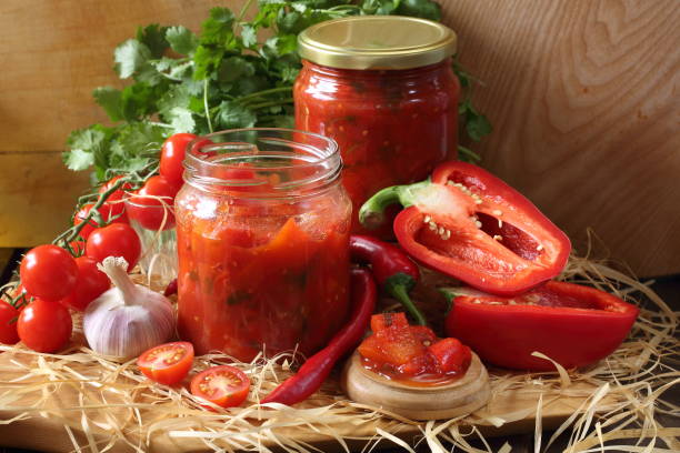 istock Lecho in glass jars on a wooden table 1472311466