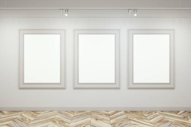 istock Contemporary gallery interior with empty white mock up poster frame on concrete wall and wooden parquet flooring. 3D Rendering. 1472311735