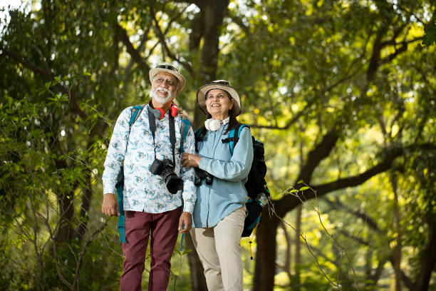 istock Senior couple having fun exploring at forest 1472311884