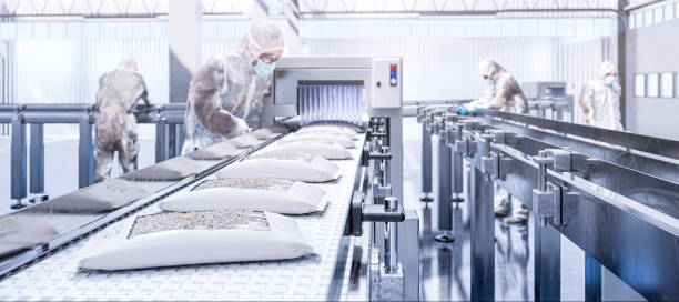 istock Production line - packing cricket larvae into paper packages 1472311975