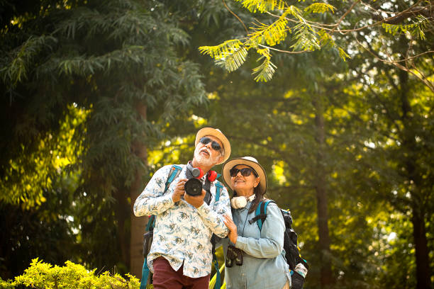 istock Senior couple having fun exploring at forest 1472312290