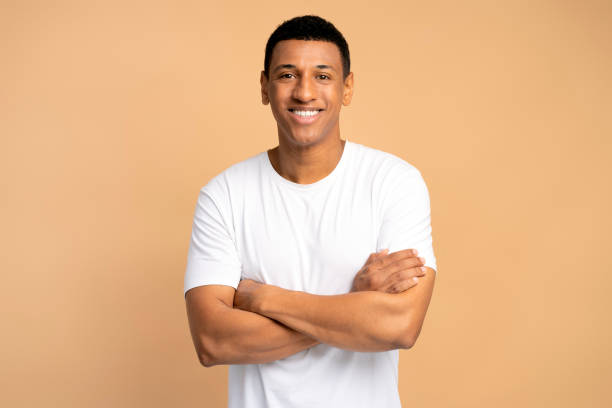istock Happy successful man posing with happy confident expression, keeping arms folded 1472315829