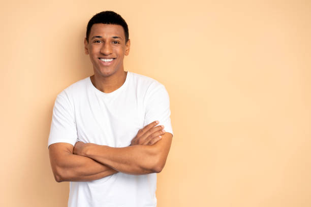 istock Happy successful man posing with happy confident expression, keeping arms folded 1472315939