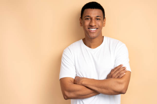 istock Happy successful man posing with happy confident expression, keeping arms folded 1472315944