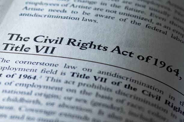 The civil rights act of 1964 title VII printed in business law textbook The civil rights act of 1964 title VII printed in business law textbook civil rights act stock pictures, royalty-free photos & images