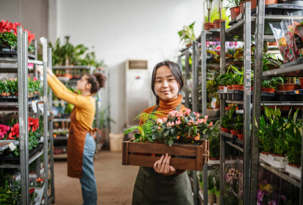 istock Small business owner and her employee working together. 1472317620