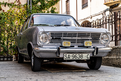 Old Opel Kadett four-door gray car parked in a central street of the city of Zamora.