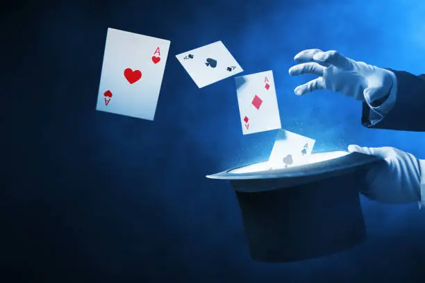 Photo of Magician hands showing magic trick