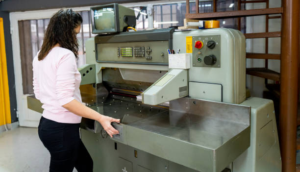 istock mature woman working in a cutting press 1472324341