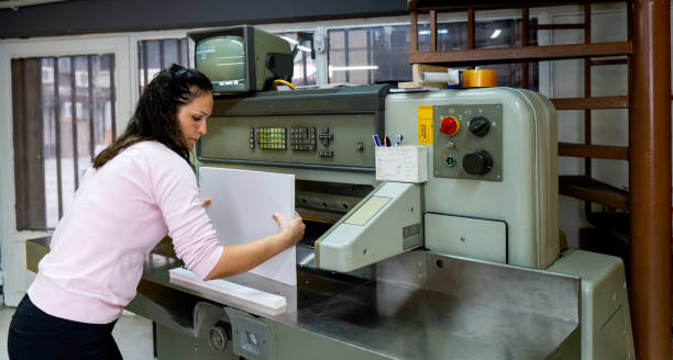 istock mature woman working in a cutting press 1472324555