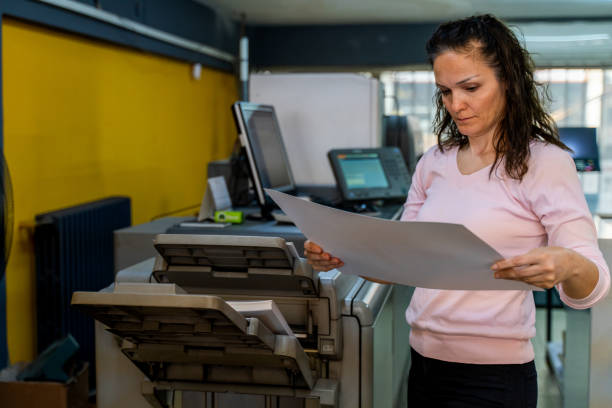 istock mature woman working in a printing press 1472327064