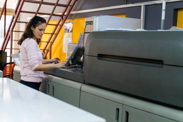 istock mature woman working in a printing press 1472327131