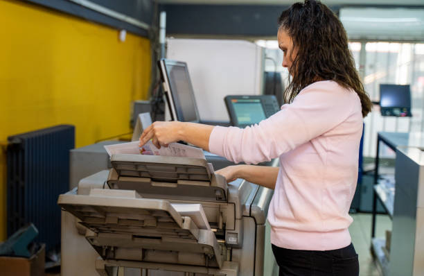 istock mature woman working in a printing press 1472327296