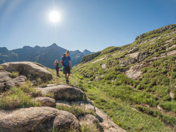 istock Couple hiking in summer, weekend activity 1472328246