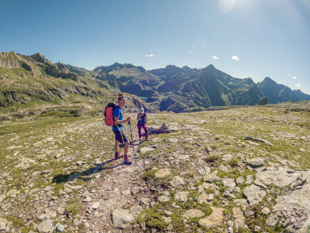 istock Couple hiking in summer, weekend activity 1472329356