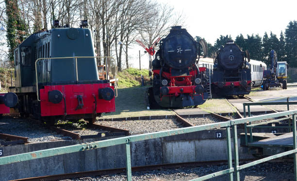 three black and red steam locomotives - railroad junction audio imagens e fotografias de stock