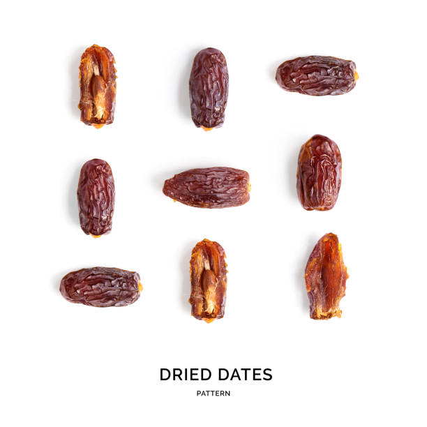istock Seamless pattern with dried dates. Tropical abstract background. Dried dates on the white background. 1472332032