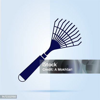 istock Garden rakes icon on blue background. 1472332150