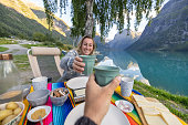 The van life, Couple having Swiss food by a beautiful lake