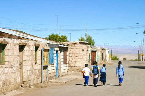 Toconao, San Pedro de Atacama region, Chile.  May 8th 2006.  Children walking home from school in the village of Toconao.
