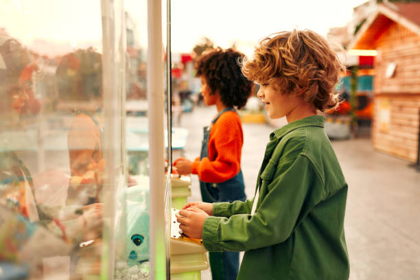 istock Kids having fun on a carnival Carousel 1472340251
