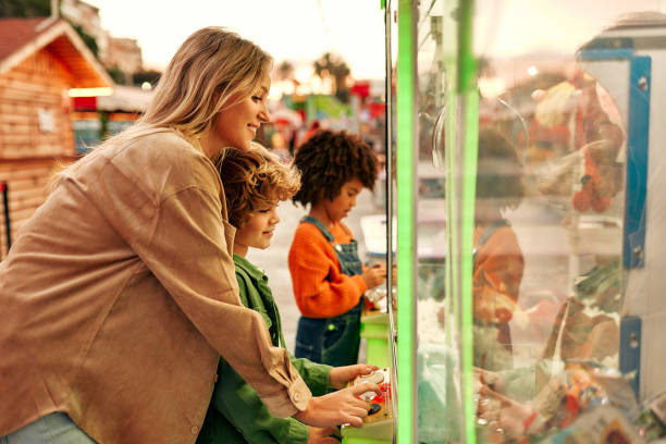 istock Kids having fun on a carnival Carousel 1472340296