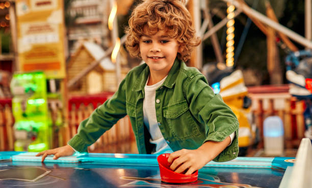 istock Kids having fun on a carnival Carousel 1472340320