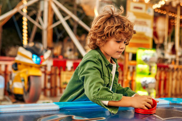 istock Kids having fun on a carnival Carousel 1472340322