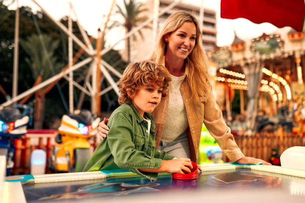 istock Kids having fun on a carnival Carousel 1472340364