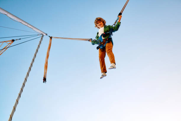 istock Kids having fun on a carnival Carousel 1472340441