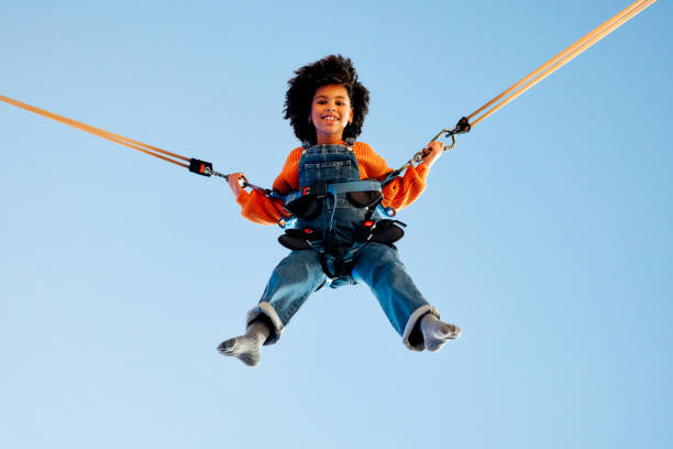 istock Kids having fun on a carnival Carousel 1472340458