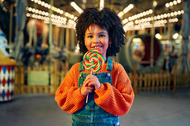 istock Kids having fun on a carnival Carousel 1472341681