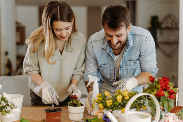 istock Young couple planting flowers 1472341687