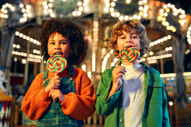 istock Kids having fun on a carnival Carousel 1472341697