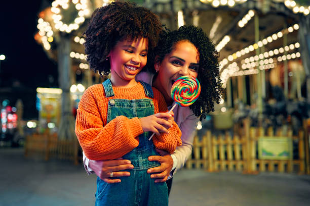 istock Kids having fun on a carnival Carousel 1472341698