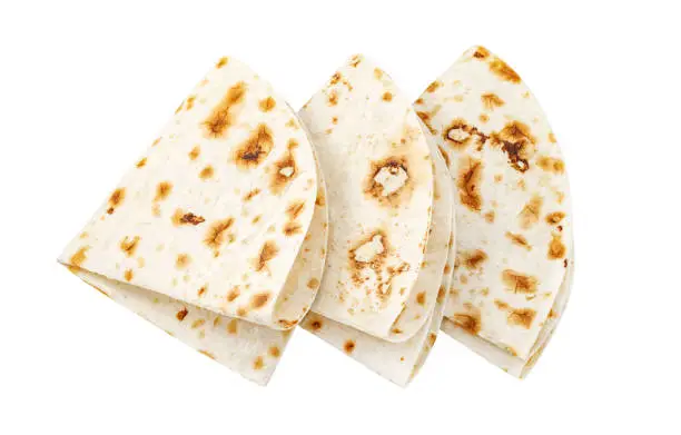 Pita tortilla lavash bread three pieces rolled into four, isolated on white background with clipping path
