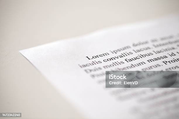 Lorem Ipsum Text On Printed On Paper In Black And White Sample Of Document Side View Selective Focus Stock Photo - Download Image Now
