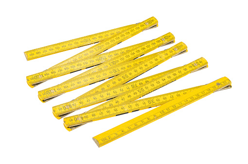 A yellow stick for do-it-yourselfers in front of a white background