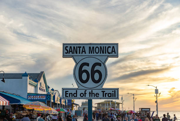Los Angeles, United States - November 17, 2022: A picture of the Route 66 Santa Monica Pier sign at sunset.