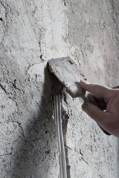 istock cable cementing in the wall with cement mortar 1472343438