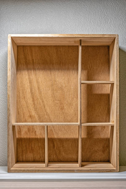 istock A vertical box or drawer with partitions, shelves, for distributing and storing small items or artifacts, as a background or template for your creativity. Interior item, showcase, storage system. 1472344710