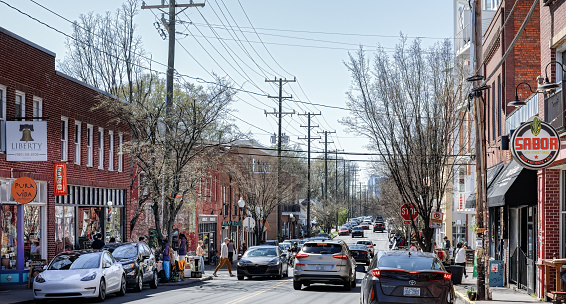 Charlotte, NC-5 March 2023: North Davidson (NoDa) on a warm, sunny winter day. Busy with traffic and pedestrians.