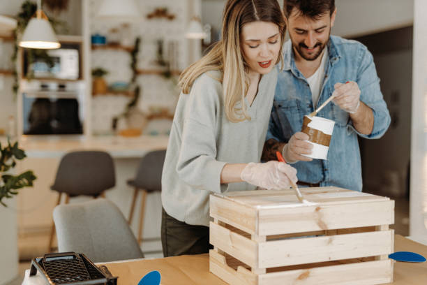 istock Young couple painting wood 1472344810