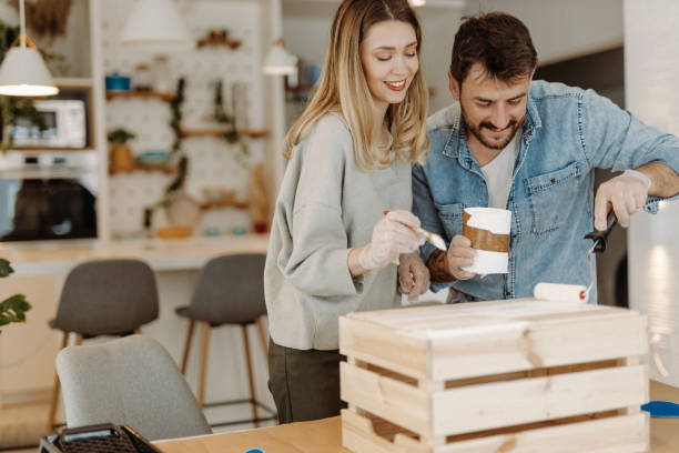 istock Young couple painting wood 1472344839